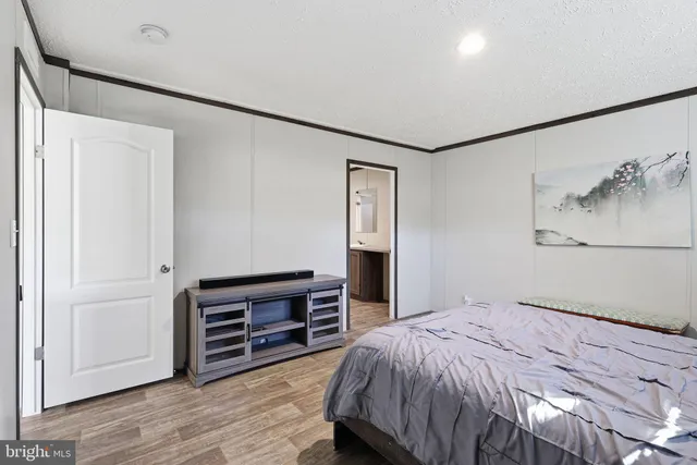 a bedroom with a bed and a cabinets