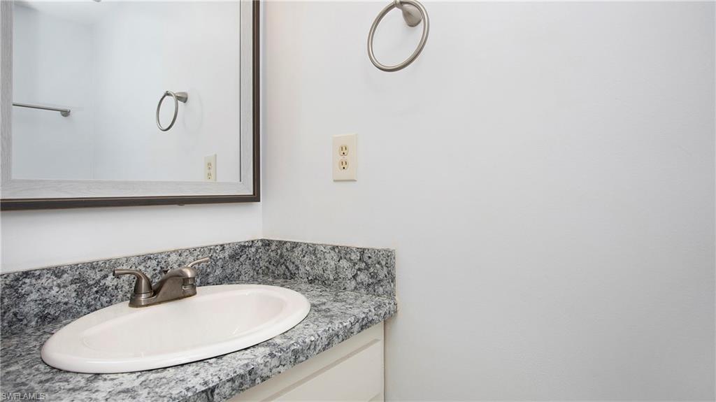 600 Valley Stream Drive, Unit C1 Naples, FL 34113 - Photo 16 of 44 1/2 Bathroom featuring vanity