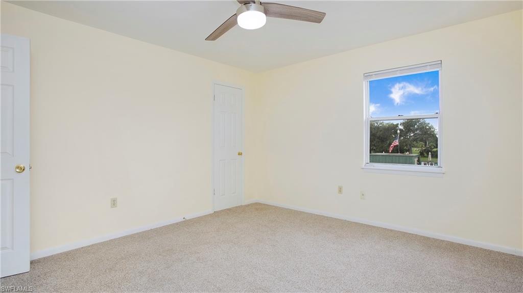 600 Valley Stream Drive, Unit C1 Naples, FL 34113 - Photo 20 of 44 2nd bedroom featuring ceiling fan and baseboards