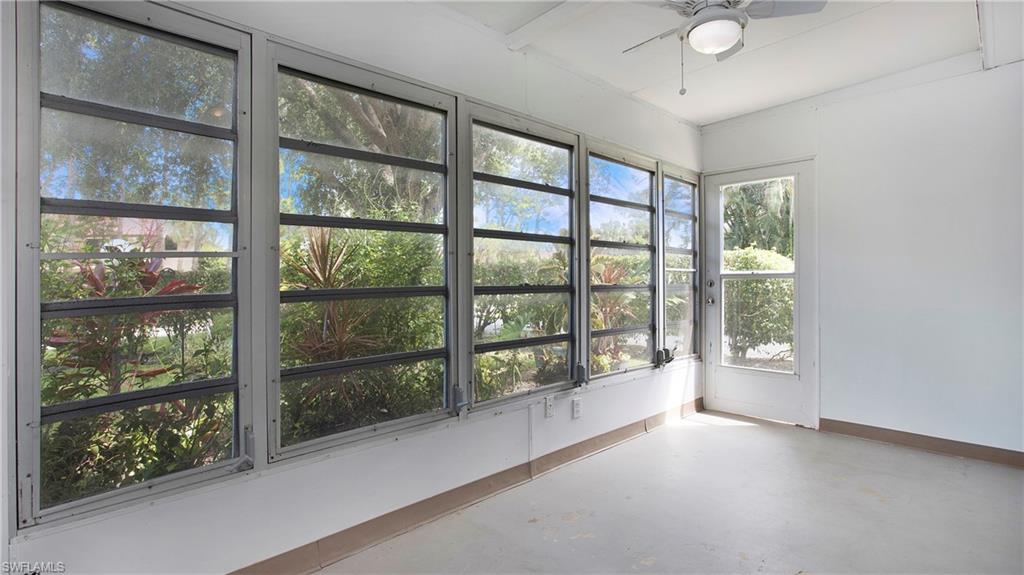 600 Valley Stream Drive, Unit C1 Naples, FL 34113 - Photo 23 of 44 Lanai with finished concrete flooring and healthy amount of natural light