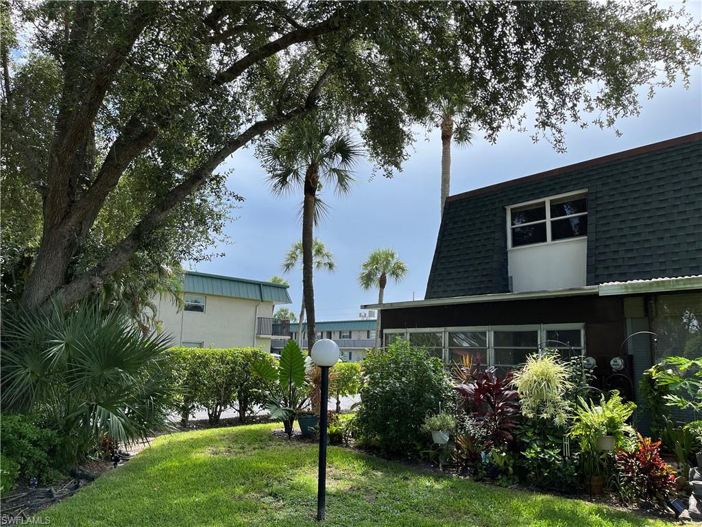 600 Valley Stream Drive, Unit C1 Naples, FL 34113 - Photo 26 of 44 View of green lawn