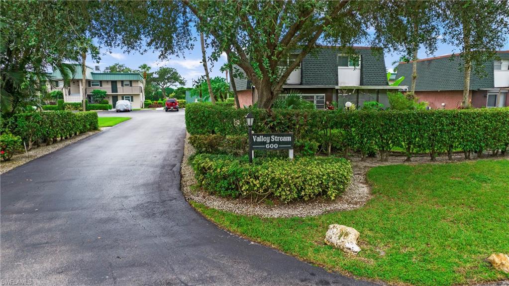 600 Valley Stream Drive, Unit C1 Naples, FL 34113 - Photo 32 of 44 View of asphalt driveway