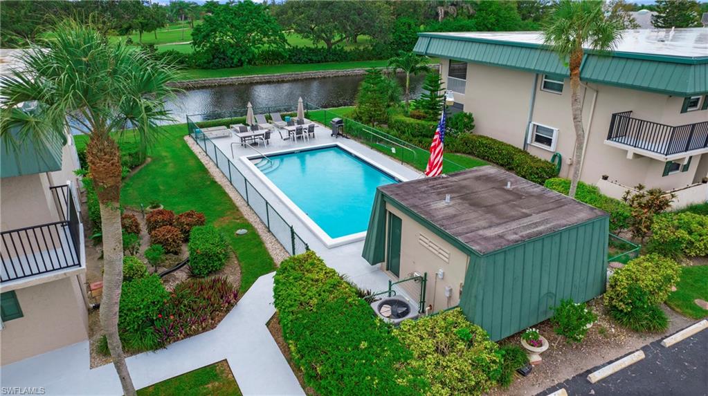 600 Valley Stream Drive, Unit C1 Naples, FL 34113 - Photo 44 of 44 Community pool with a water view and a patio area