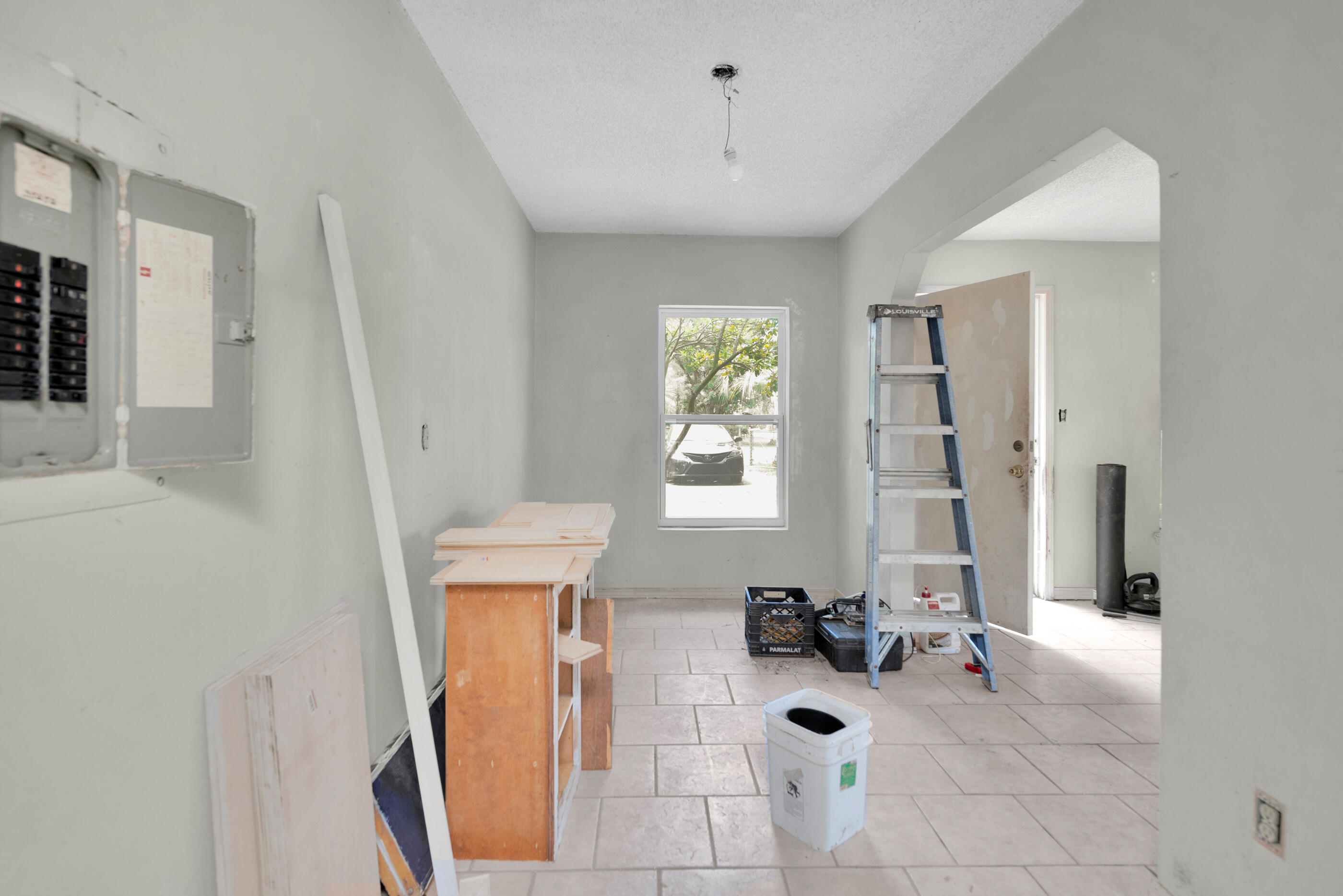 8156 4th Street Navarre, FL 32566 - Photo 17 of 23 a view of a hallway with couches and a chandelier