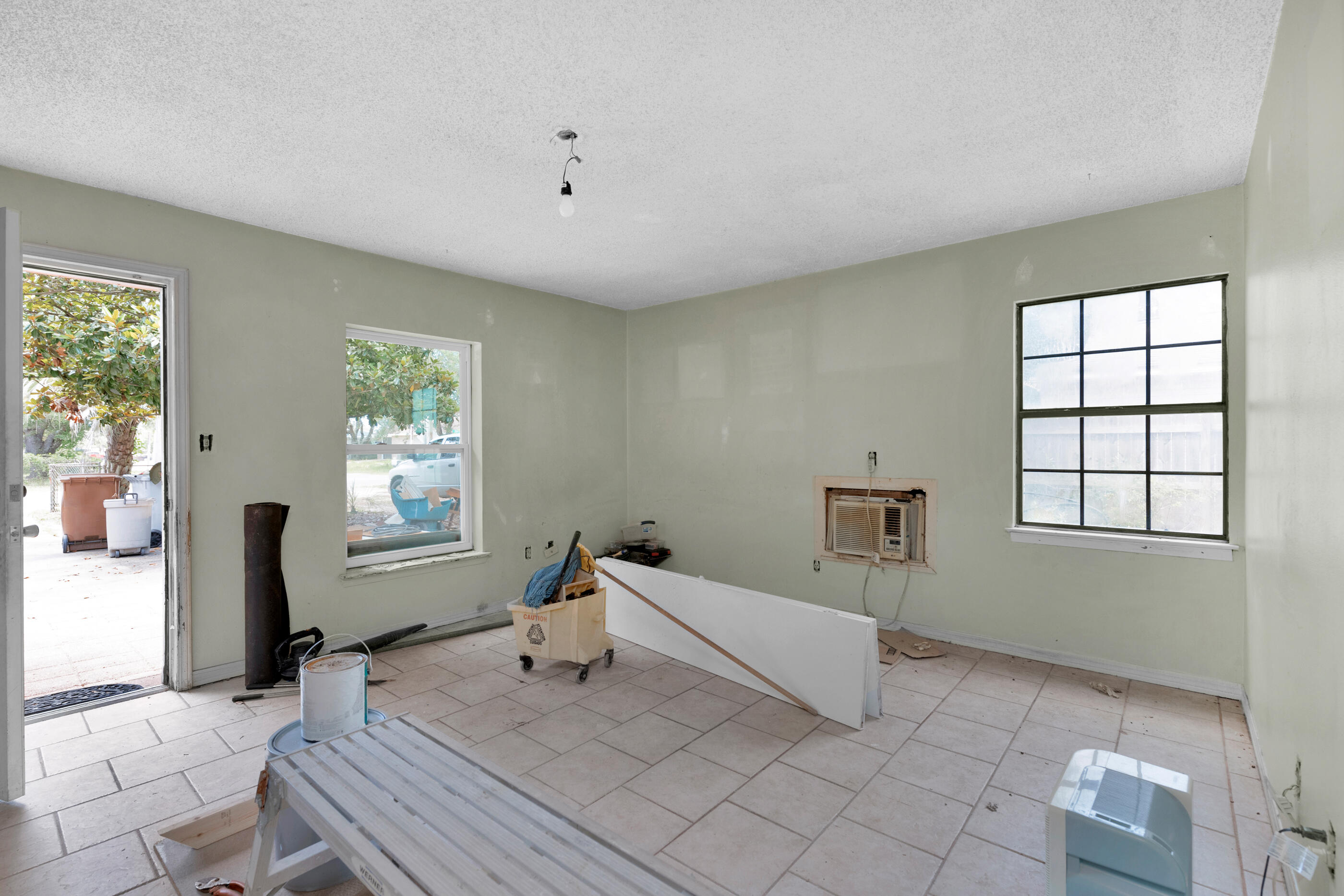 8156 4th Street Navarre, FL 32566 - Photo 19 of 23 a spacious bedroom with a bed and a window