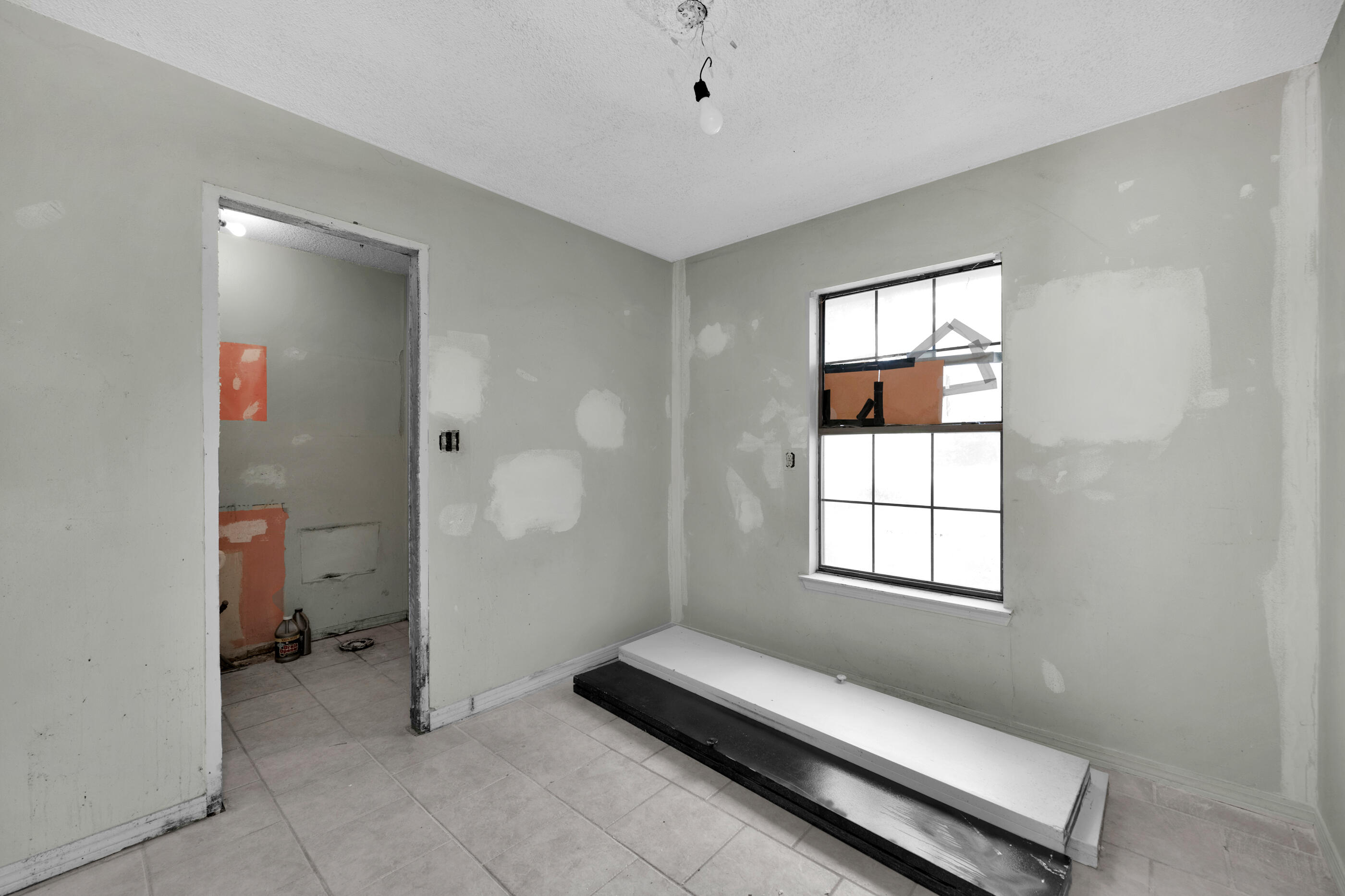 8156 4th Street Navarre, FL 32566 - Photo 20 of 23 a hallway with a couch and a window