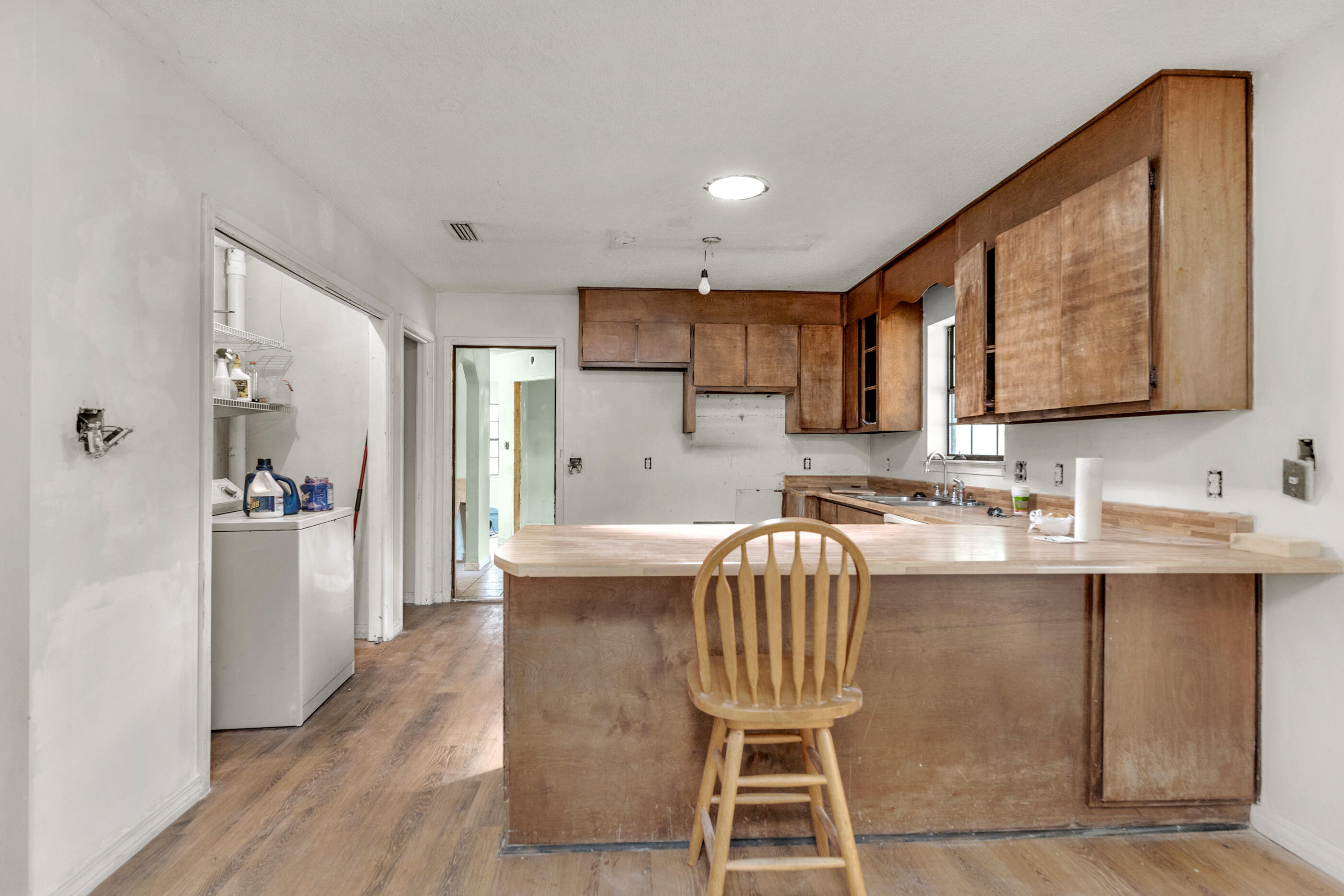 8156 4th Street Navarre, FL 32566 - Photo 8 of 23 a kitchen with a sink cabinets and window