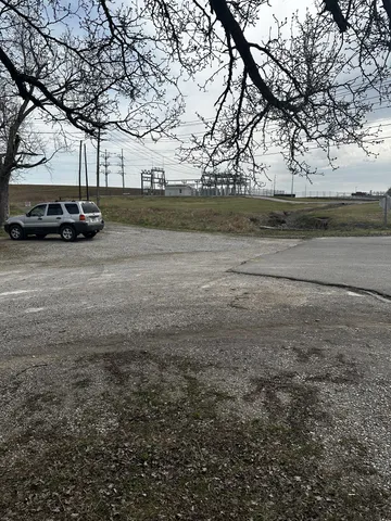 a view of a car parked in front of a house