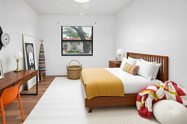 a bedroom with bed and a couch