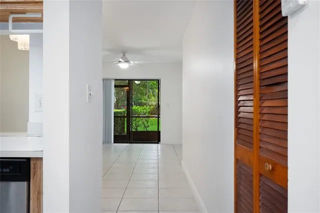 a view of hallway with a sink and a window