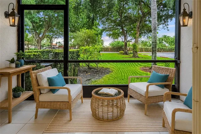 a balcony with wooden floor and outdoor seating