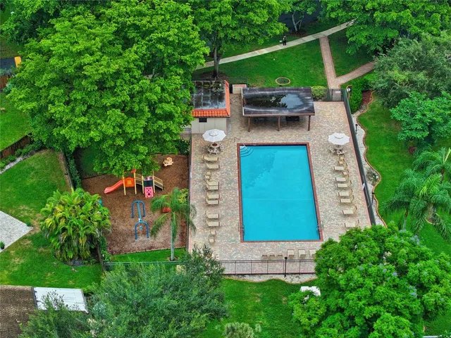aerial view of a house with a yard