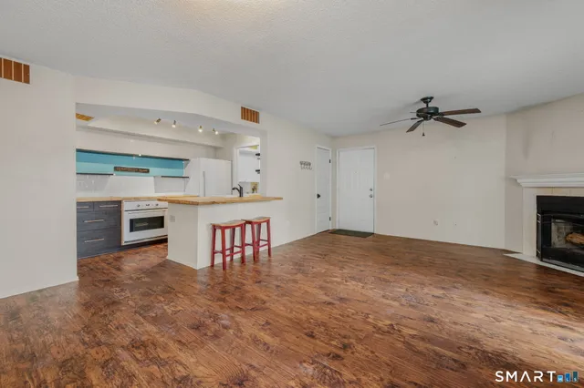 a view of kitchen and sink with cabinets