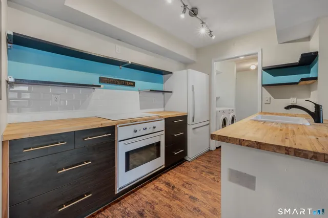 a kitchen with a stove and a sink