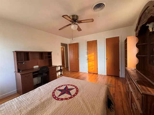 a bed room with a bed and a television