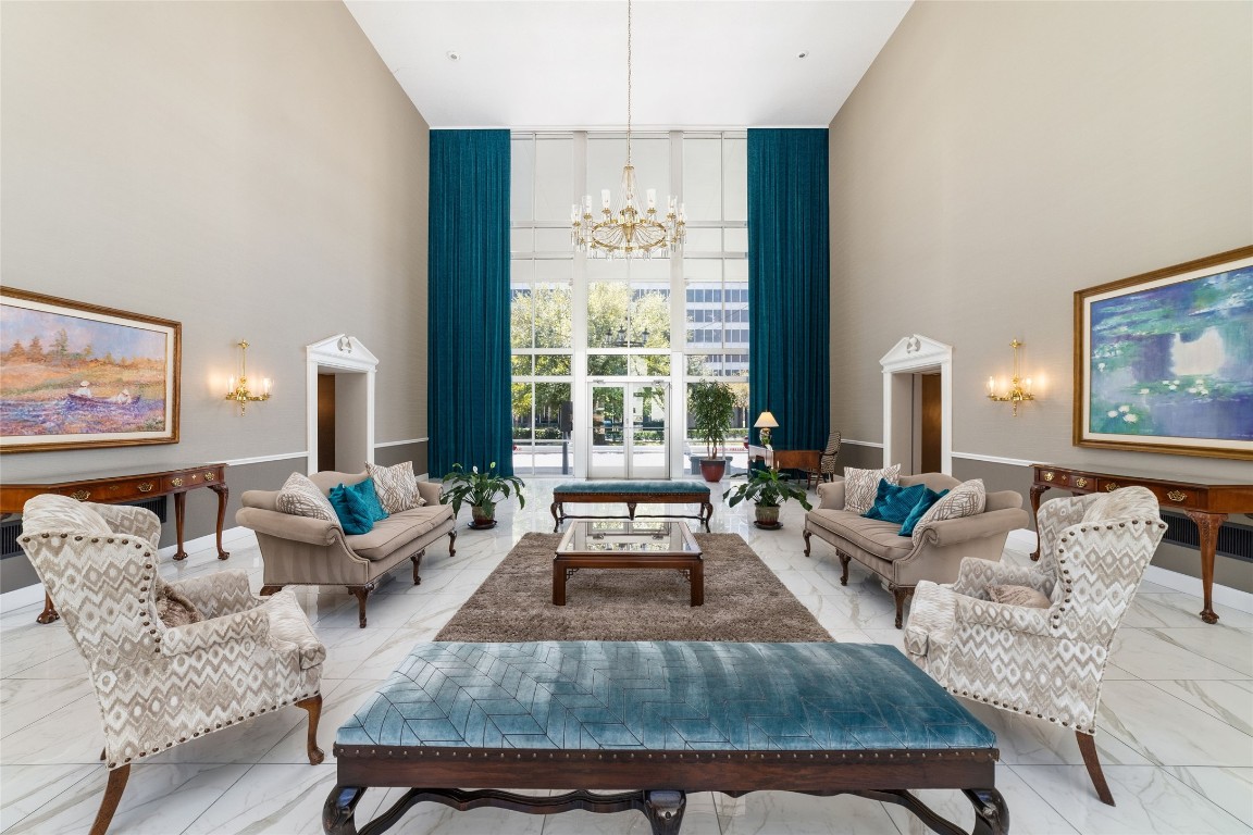 5050 Ambassador Way, Unit 309 Houston, TX 77056 - Photo 17 of 42 a living room with furniture and a large window