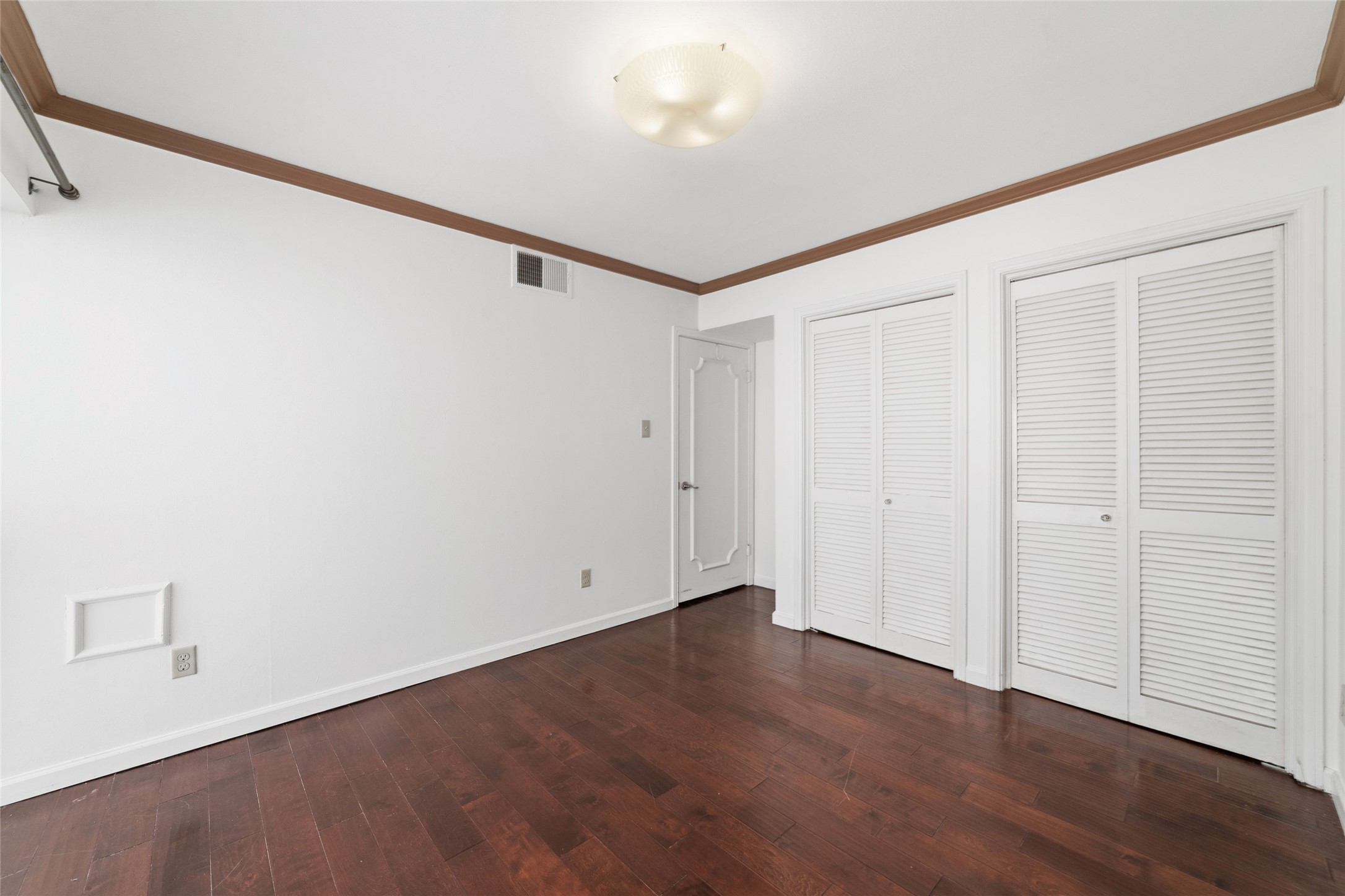 5050 Ambassador Way, Unit 309 Houston, TX 77056 - Photo 37 of 42 a view of an empty room with wooden floor