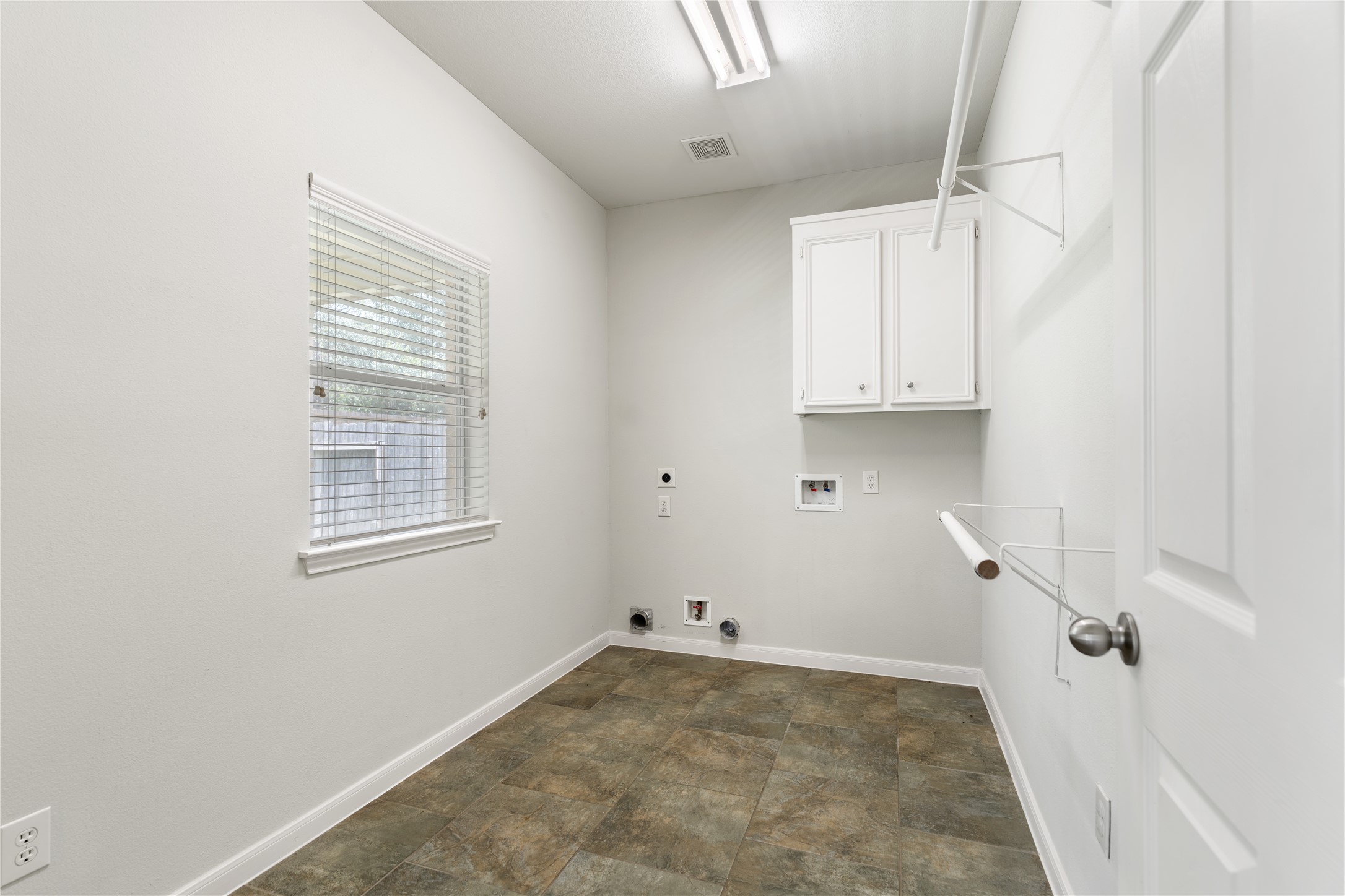 25827 Austin Springs Spring, TX 77373 - Photo 29 of 34 Spacious laundry room that can be used as additional storage.