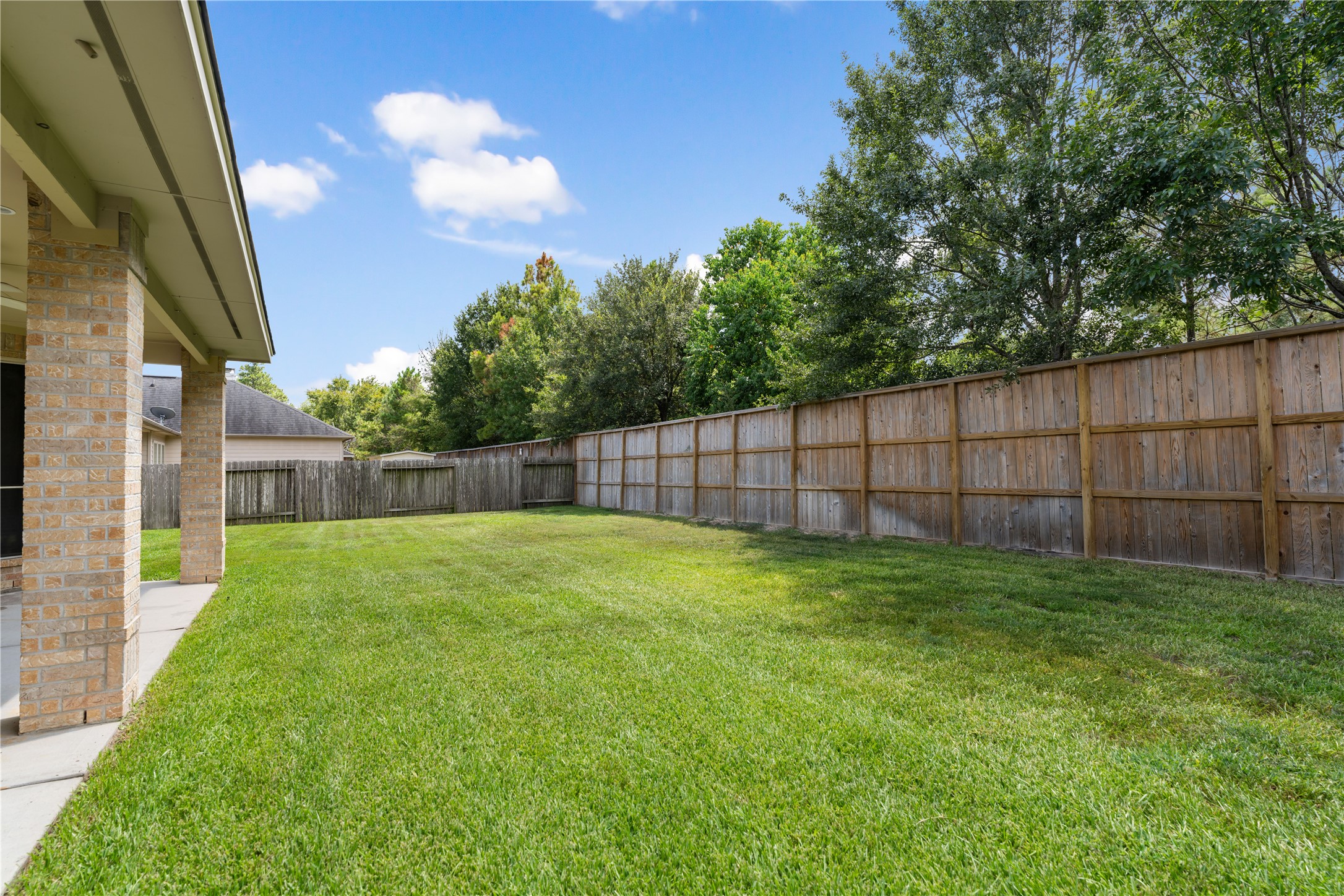 25827 Austin Springs Spring, TX 77373 - Photo 32 of 34 Oversized yard, beautifully maintained grass and new fence!
