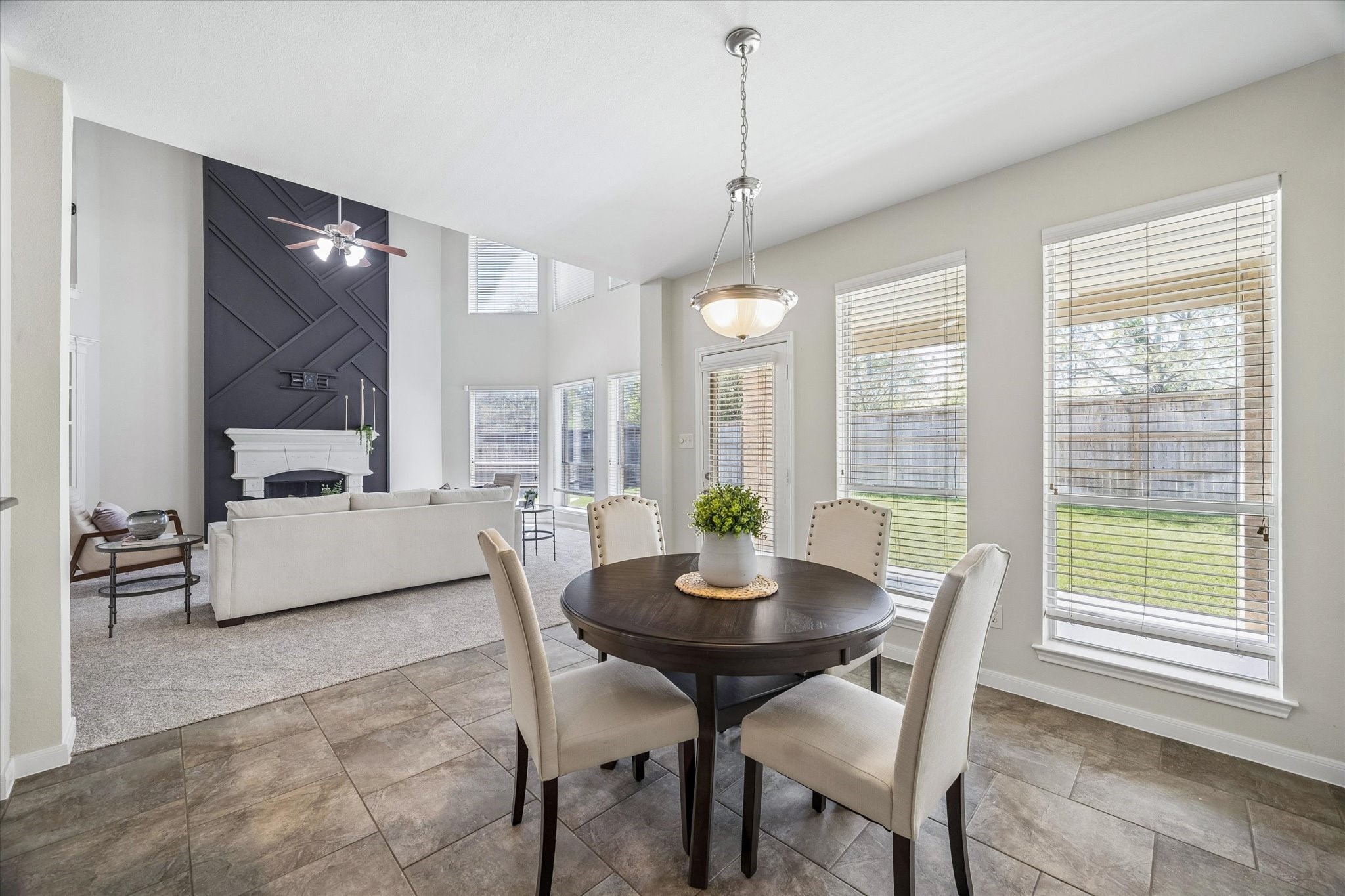 25827 Austin Springs Spring, TX 77373 - Photo 10 of 34 Breakfast nook connecting the kitchen and living and leading out onto covered porch and backyard