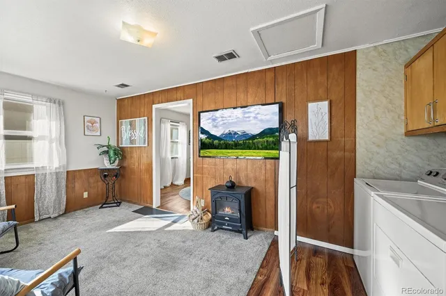 a hallway with a sink and cabinets