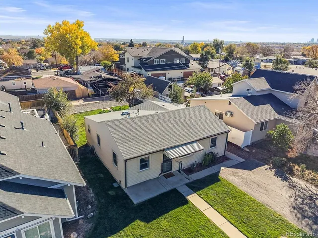 an aerial view of a house with a big yard