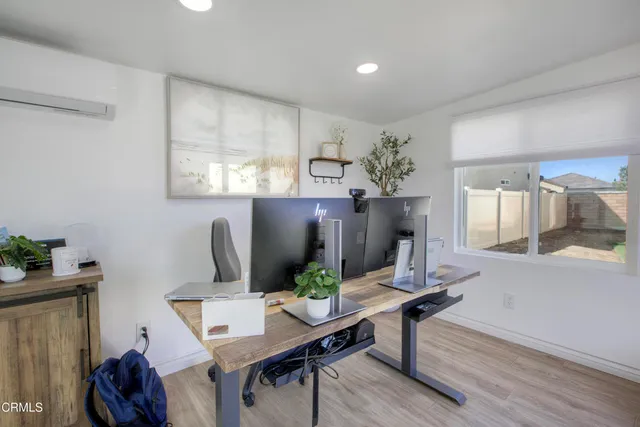 a view of a workspace with furniture