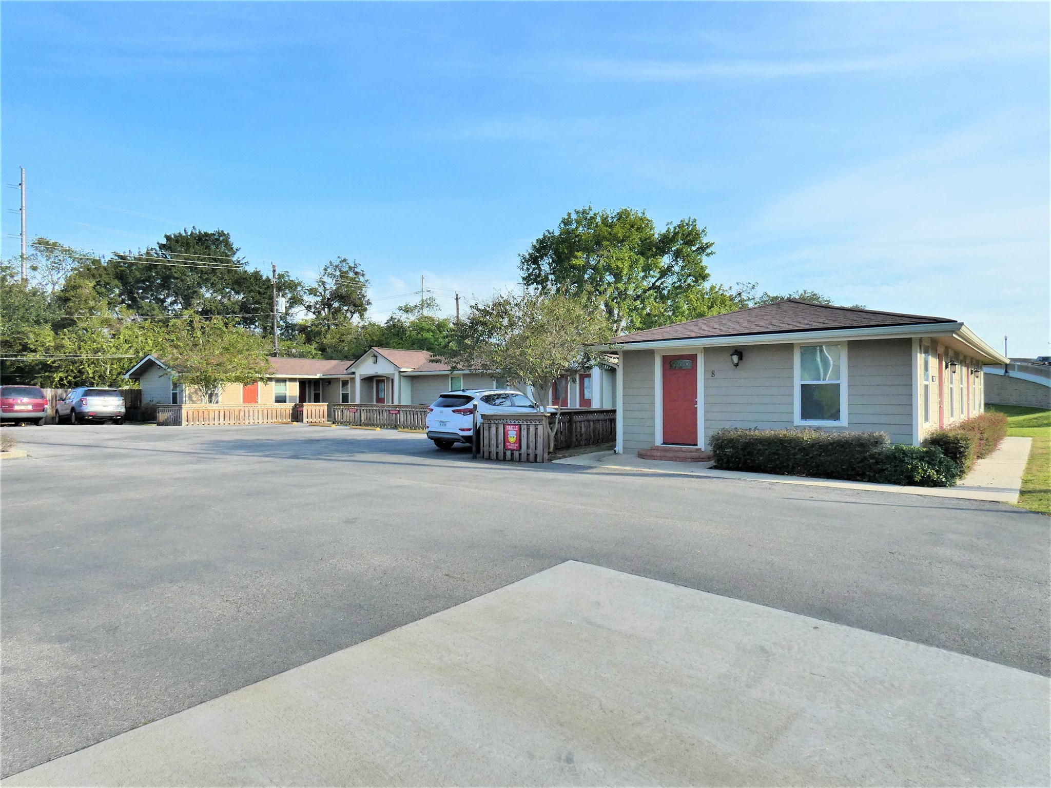 507 Houston Street, Unit 4 Rosenberg, TX 77471 - Photo 19 of 27 a view of a house with a cars park next to a road