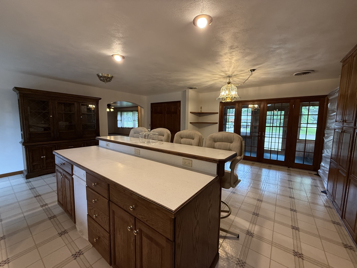 1048 Warren Street Henry, IL 61537 - Photo 10 of 26 a large kitchen with a table and chairs