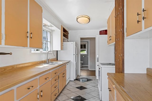 a spacious bathroom with a granite countertop sink and a mirror