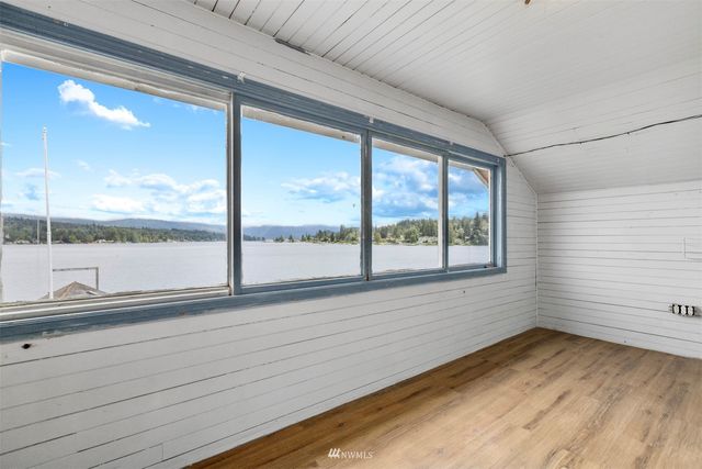 a view of a room with a large window