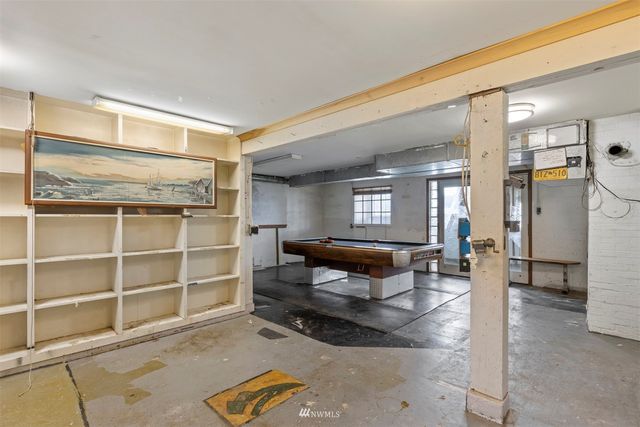 a living room with furniture a window and a table