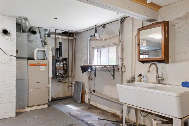 a bathroom with a mirror sink and shower
