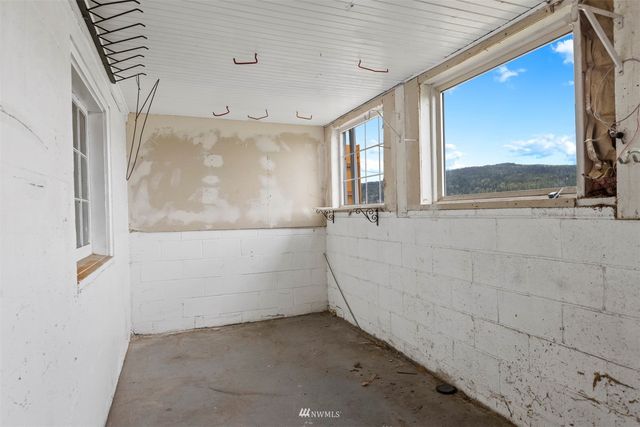a front view of a house with yard and green space