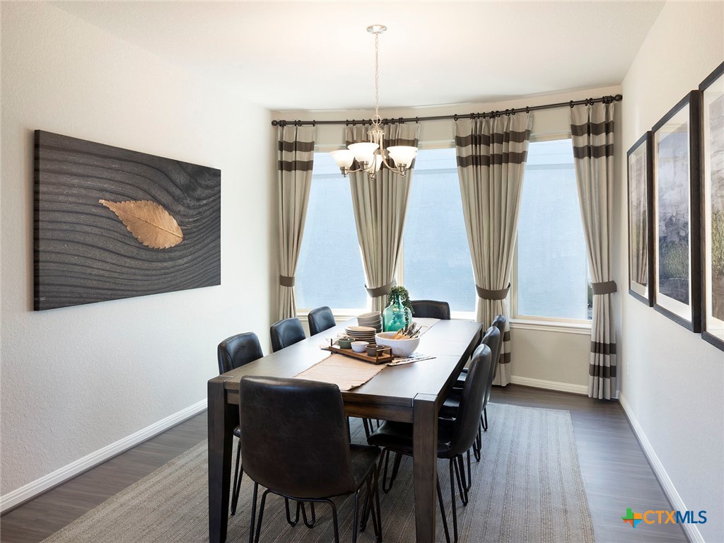 137 Dakota Ridge Cibolo, TX 78108 - Photo 6 of 7 a view of a dining room with furniture window and wooden floor