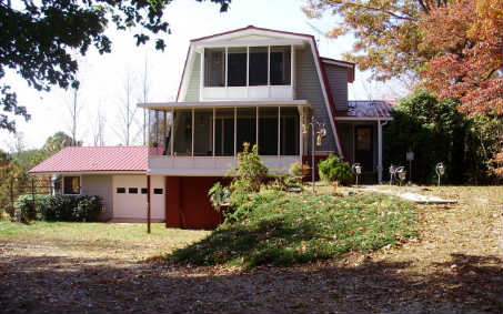 404 Mission Ridge Road Murphy, NC 28906 - Photo 1 of 1 a front view of a house with a yard and garage