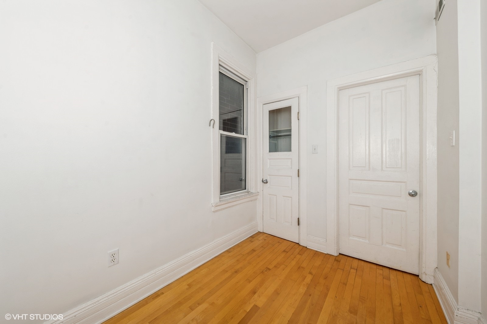 1729 West Erie Street, Unit 3N Chicago, IL 60622 - Photo 8 of 11 a view of empty room with wooden floor