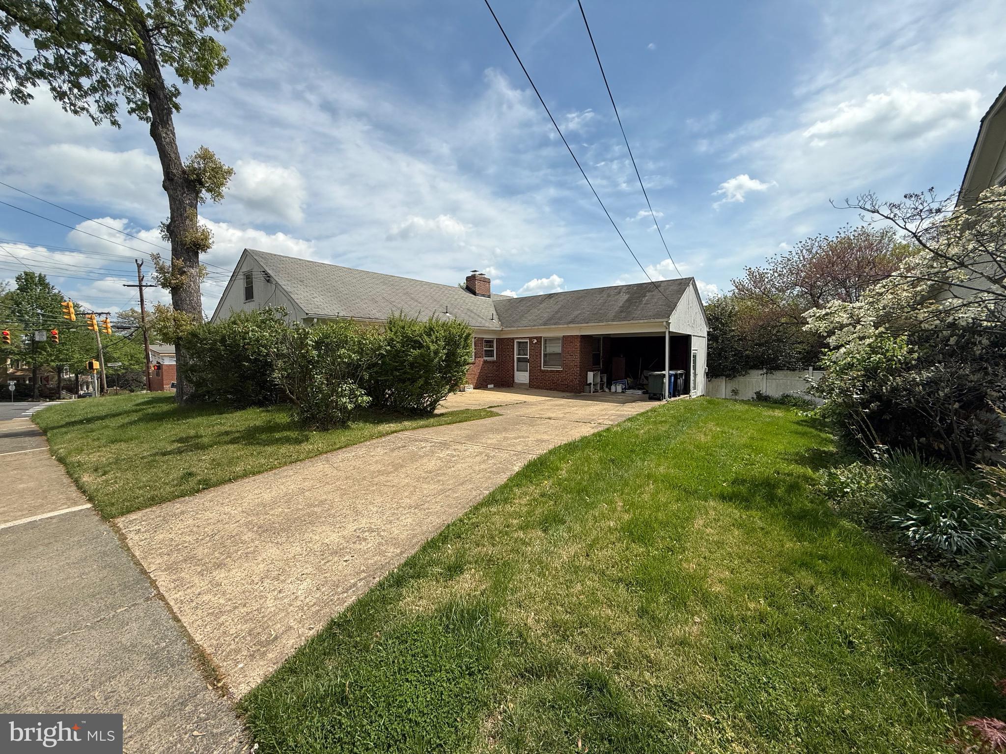 a view of a patio with table and chairs under an umbrella