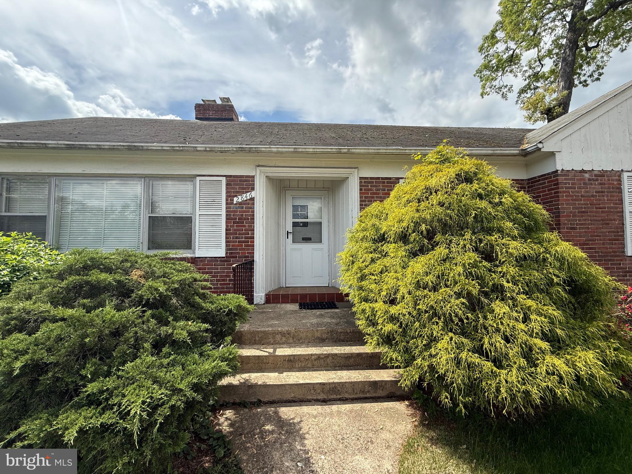 2846 Lorcom Lane Arlington, VA 22201 - Photo 6 of 8 a front view of a house with a garden