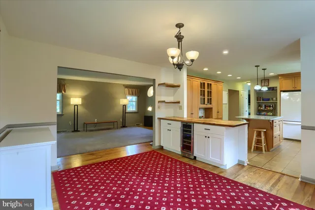 a large bathroom with a sink a large mirror and a shower