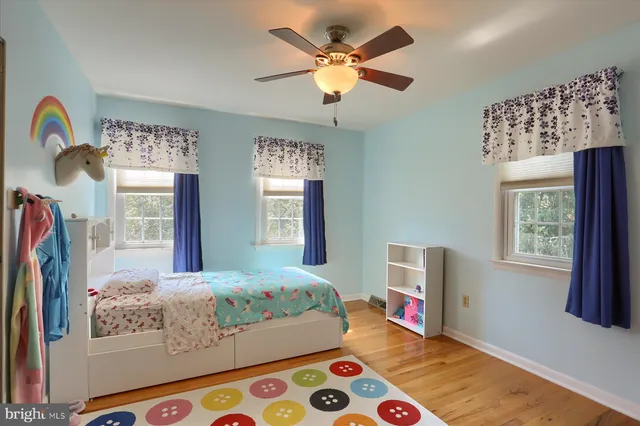 a bedroom with bed and a window