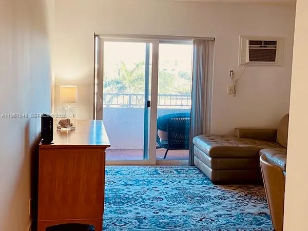 a room with a sink and cabinets