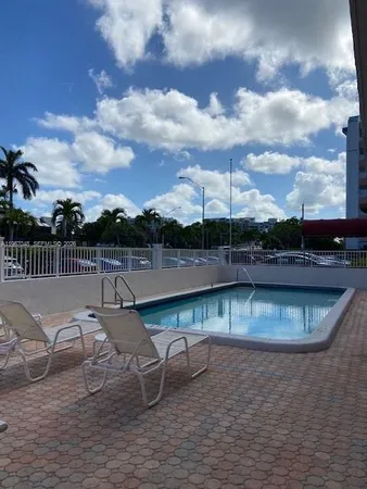 a view of swimming pool from a balcony