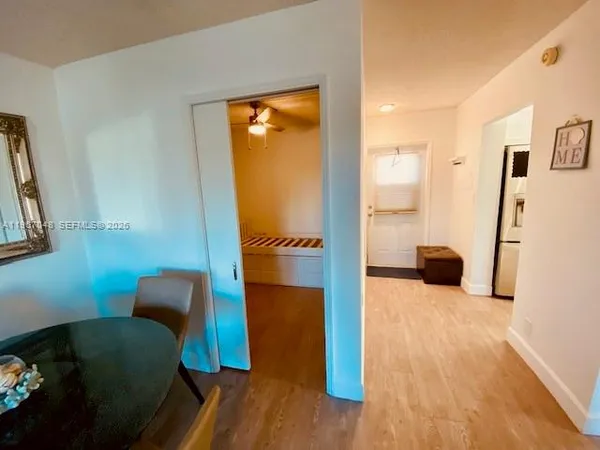 a living room with furniture rug and a floor to ceiling window