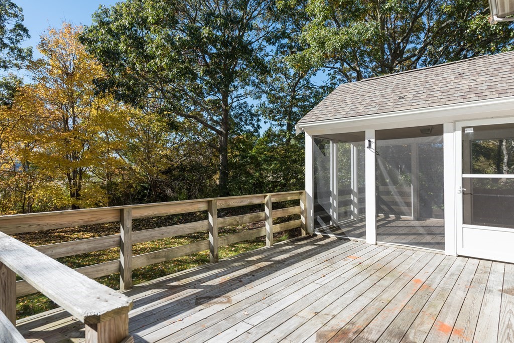 47 Webster Road Yarmouth, MA 02673 - Photo 4 of 19 a view of backyard with wooden floor and fence