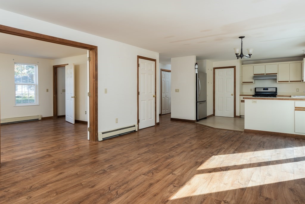 47 Webster Road Yarmouth, MA 02673 - Photo 7 of 19 a view of a kitchen with a sink and a refrigerator