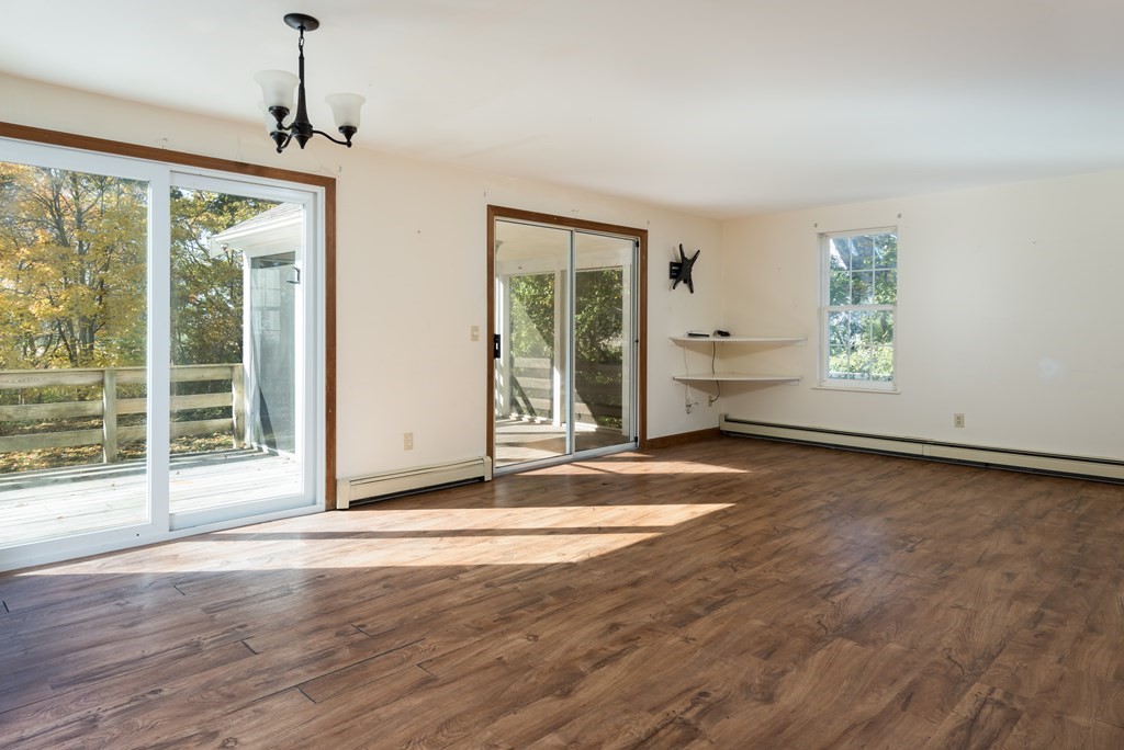 47 Webster Road Yarmouth, MA 02673 - Photo 8 of 19 a view of empty room with wooden floor and fan