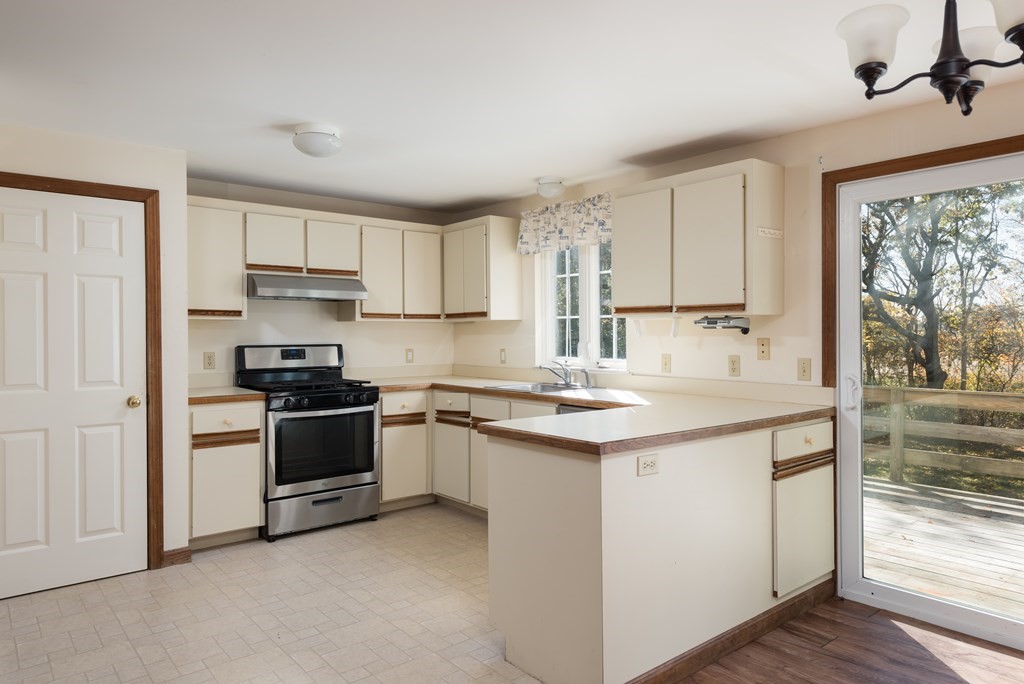 47 Webster Road Yarmouth, MA 02673 - Photo 9 of 19 a kitchen with stainless steel appliances a sink stove and refrigerator