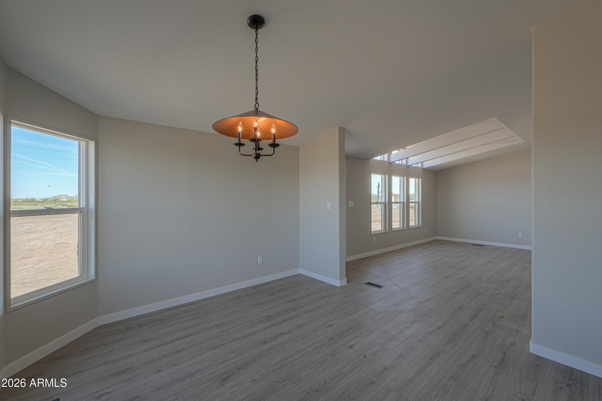 161 North Pueblo Road Maricopa, AZ 85139 - Photo 16 of 76 a view of an empty room with a window