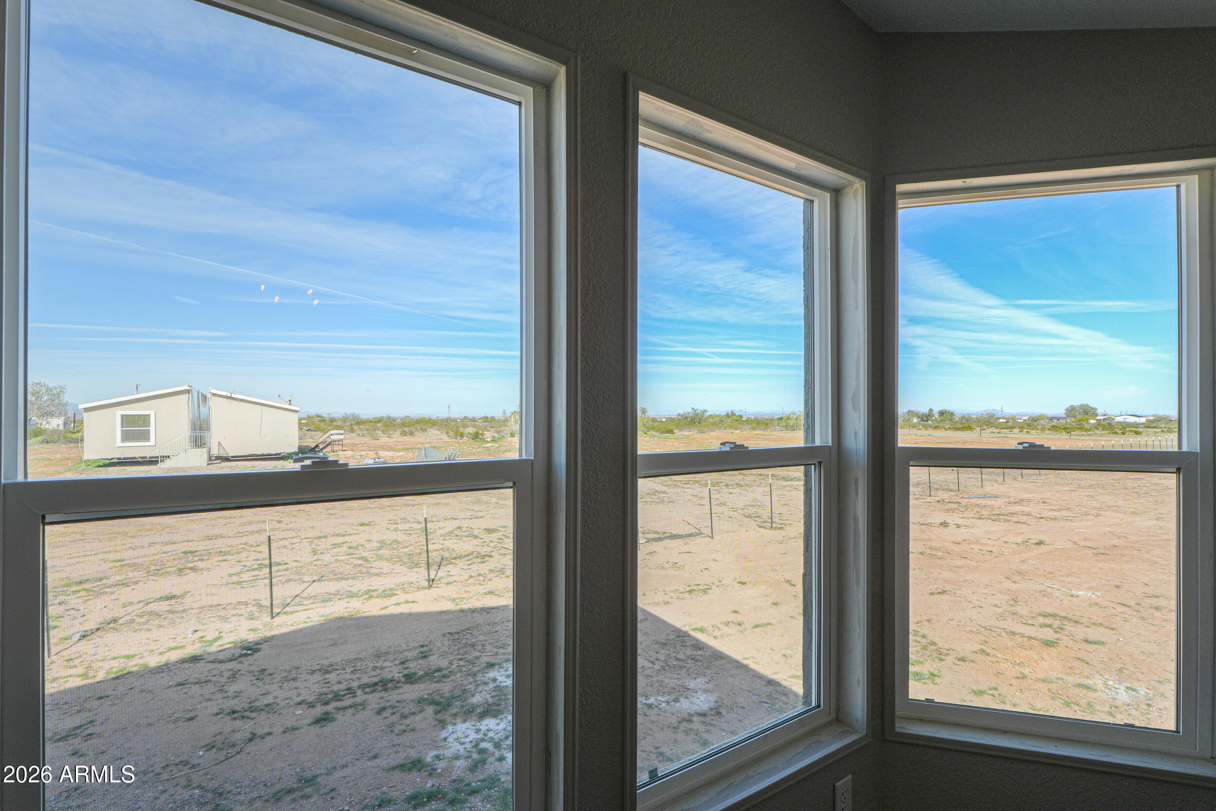 161 North Pueblo Road Maricopa, AZ 85139 - Photo 17 of 76 a view of a glass door with a large window
